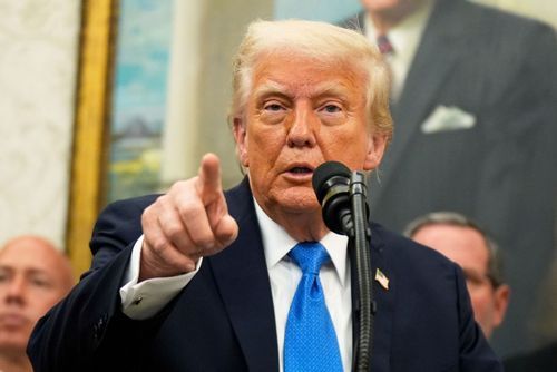 President Trump and U.S. Military Academy Superintendent Lt. Gen. Steven Gilland listen to the national anthem before Mr. Trump delivers the commencement address at the 2025 graduation ceremony at West Point